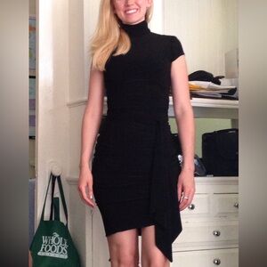 Cache’ black asymmetric draped dress. Gorgeous figure flattering soft fabric.